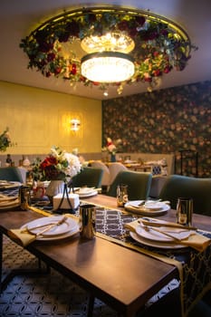 the interior of the restaurant room in the evening.