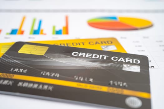 Credit card model on chart and graph spreadsheet paper. Finance development, Banking Account, Statistics, Investment Analytic research data economy, Stock exchange trading, Business company concept.