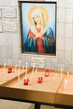 PARIS, FRANCE - SEPTEMBER 03, 2022: Armenian Apostolic Church of Saint Marie mere de Dieu in Paris candles for peace