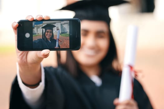 Selfie, certificate and woman with phone in graduation event due to success or achievement on college or university campus. Graduate, happy and young person or student with an education scholarship.