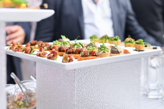 Small Canapes appetizers at the wedding