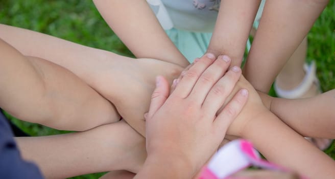 children, friends are playing in the garden, holding hands. selective focus