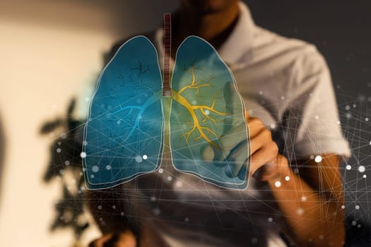 Close up of female doctor holding tablet with abstract glowing lung interface with virus outline on dark background. Medicine, pandemic and healthcare concept. Double exposure. High quality photo