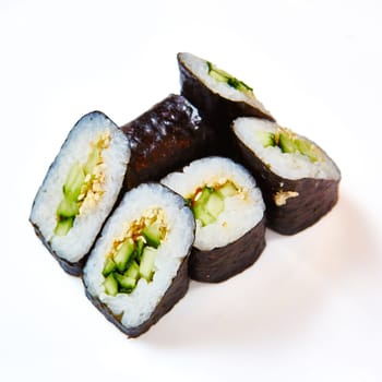 Japanese cuisine. Sushi roll with avocado on white background.