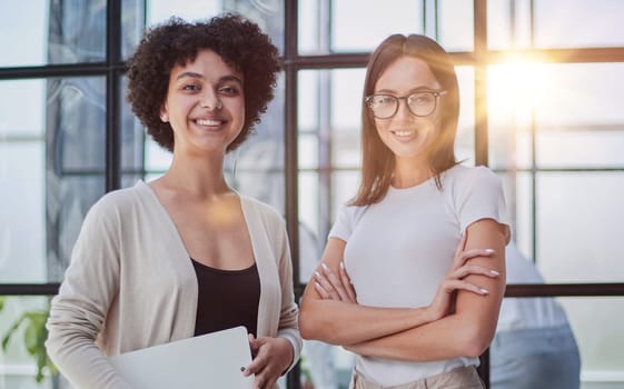 Businesswomen Having Informal Meeting In Modern Office