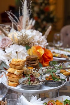 assorted snacks with bruschetta and pate on the festive table.