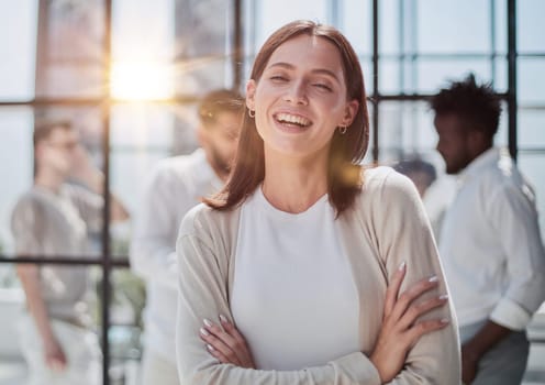 Face of beautiful woman on the background of business people