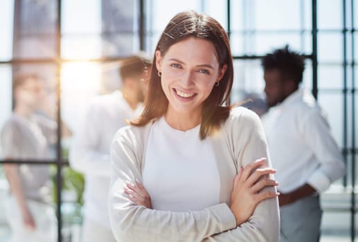 Face of beautiful woman on the background of business people
