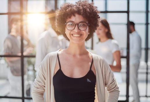 Face of beautiful woman on the background of business people