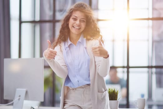 Photo of happy web designer look camera show thumb up