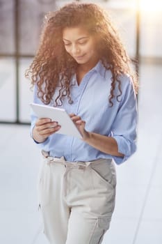 millennial girl employee holding modern tablet device feels happy enjoy break at workplace