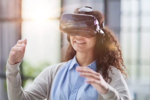 Girl trying to touch objects in virtual reality.