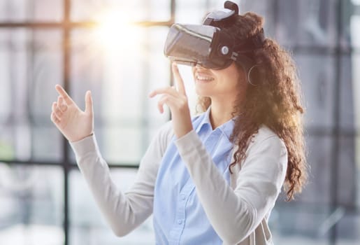 Girl trying to touch objects in virtual reality.