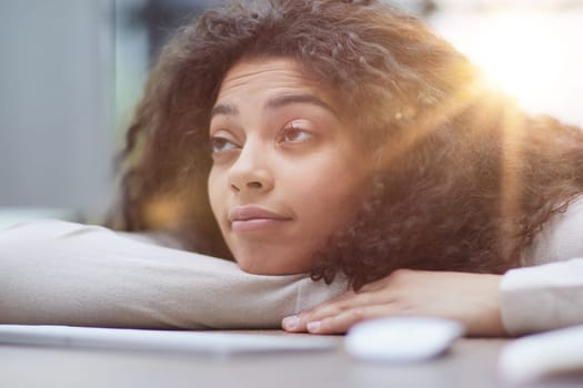 Portrait of a beautiful business woman sleeping on the table in the office