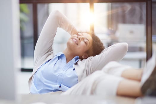 Tired businesswoman sleeping with closed eyes at workplace in office