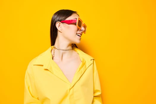 girl woman young person modern lifestyle glamour fashion beautiful attractive studio dance monochrome positive romance trendy sunglasses yellow isolated expression joy