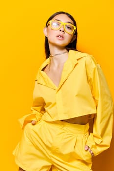 woman cheerful young lifestyle lovely romance lady beautiful trendy person background attractive funny isolated yellow joyful girl glasses fashion joy happiness