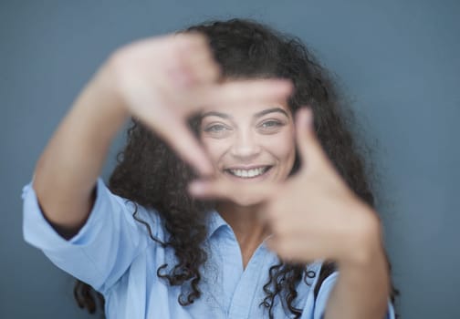 Photo of cheerful self-assured lady folded arms wear blue shirt grey color background