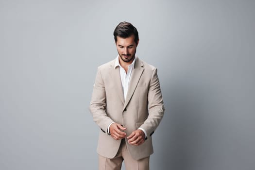 folded man guy job copyspace smiling smile happy suit portrait isolated handsome crossed formal attractive beige background businessman person business model
