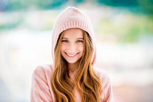 Beautiful teenage girl wearing hood