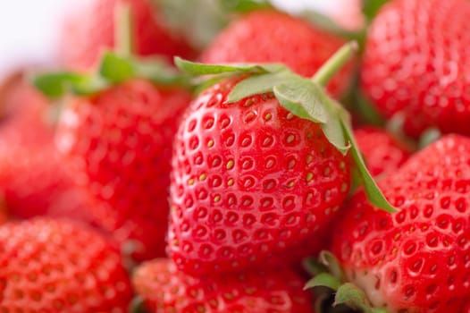 Beautiful and delicious strawberries in a wooden box basket, concept of organic farming, fresh direct delivery from orchard, close up.