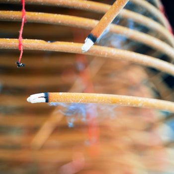 Burned coil swirl incense in Macau (Macao) temple,traditional Chinese cultural customs to worship god,close up,lifestyle.