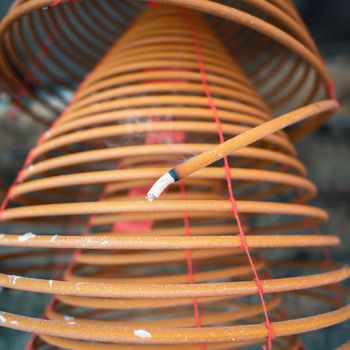 Burned coil swirl incense in Macau (Macao) temple,traditional Chinese cultural customs to worship god,close up,lifestyle.