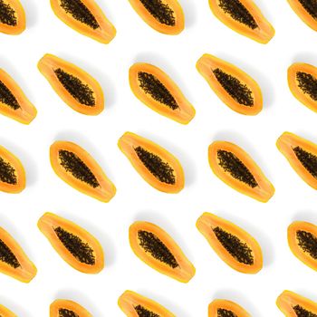Fresh ripe papaya seamless pattern on white background. Tropical abstract background. Top view. Creative design, minimal flat lay concept. Trend tropical fruit food background pattern