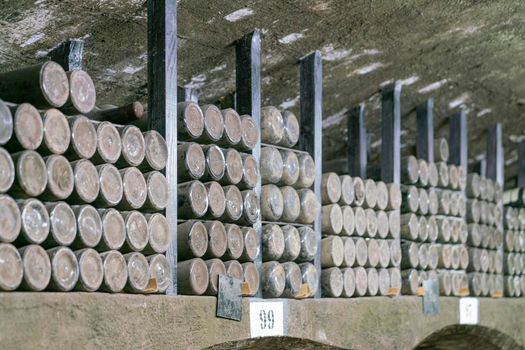 collections of old wine bottles in wine cellars. High quality photo