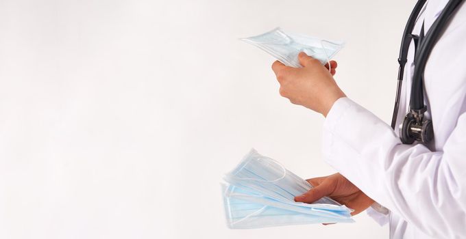 Doctor or nurse recommend to use protective face mask to protect from virus infection
