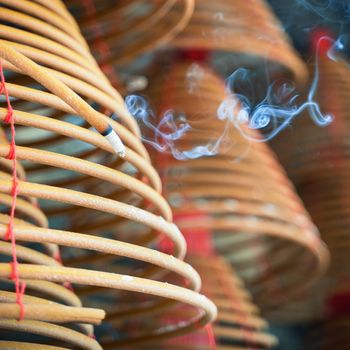 Burned coil swirl incense in Macau (Macao) temple,traditional Chinese cultural customs to worship god,close up,lifestyle.