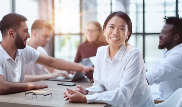 Happy young woman and looking at the camera. Portrait of a smiling businesswoman