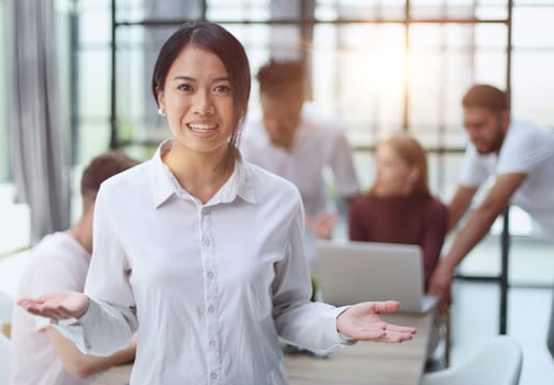 young successful businesswoman in white shirt smiling in the office