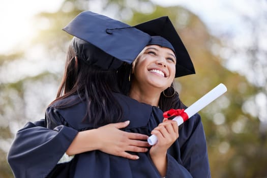 Graduation, education and woman friends hugging at a university event on campus for celebration. Graduate, certificate and hug with female students together in support of a scholarship achievement.