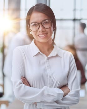 Young beautiful Asian business woman consultant working in the office,