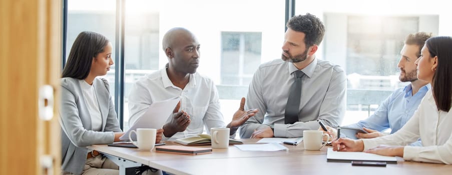 Collaboration, teamwork or business people in meeting for project management or speaking of a strategy. Black man, corporate or employees talking in discussion with our vision for growth in office.