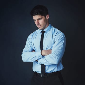 Next time, Ill try have to try harder. Studio shot of a young businessman looking thoughtful against a dark background