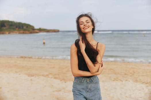 summer woman lifestyle sunlight carefree long beauty coast beach walk peaceful sunset travel sea sand enjoyment vacation person smile hair caucasian ocean