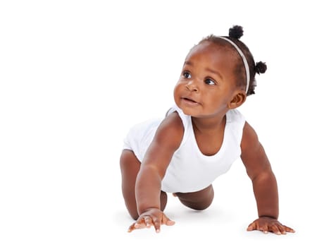 Isolated, baby crawling and against a white background on the floor. Childhood or milestone, child development or playing and black toddler crawl alone against a studio backdrop on the ground.