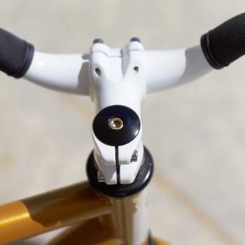 Fitness, sports and handle with a closeup of a bike outdoor from above for a cycle or ride for cardio training. Exercise, health and a bicycle outdoor for an endurance workout or cycling marathon.