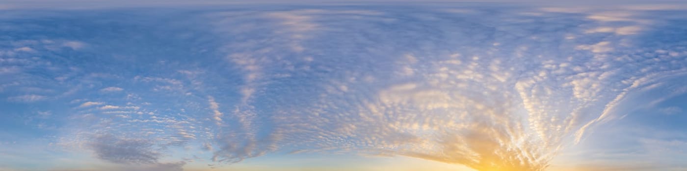 Bright sunset sky panorama with Cirrus clouds. Seamless hdr spherical equirectangular 360 panorama. Sky dome or zenith for 3D visualization, game and sky replacement for aerial drone 360 panoramas.