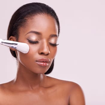 Cosmetics, makeup brush and black woman with mockup in studio with foundation tool. Skincare, blush and cosmetic facial skin care, African beauty model with luxury product on pink background