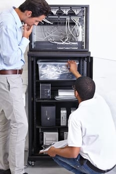 Information technology, men and clipboard in server room for fixing, inspection and maintenance. Checklist, IT technician and computer in data center for cybersecurity, networking or database repair