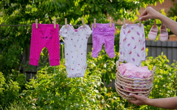 washing baby clothes. Linen dries in the fresh air. Selective focus. nature.