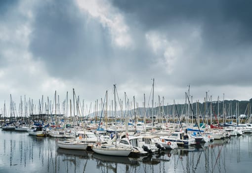 View of the harbor of the French village of Binic with pleasure boats and yachts at anchor.