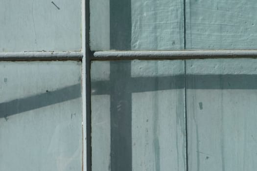 Old cyan blue wooden plank door with texture. Concept for backgrounds and textures.