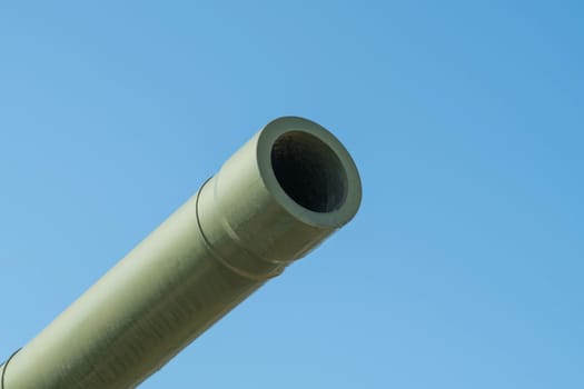 the barrel of the tank against the blue sky. photo