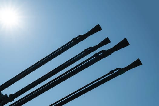 anti-aircraft gun barrels against a blue sky background. photo