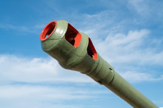 the barrel of the tank against the blue sky. photo