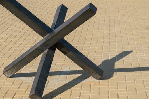 metal anti-tank fence in the city close-up. photo